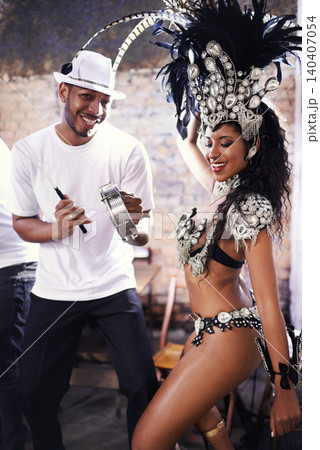 Dancer, carnival and woman with performance, band or pride for culture in group, music or concert in night. Girl, smile and people dancing at event, party or celebration for history in Rio de Janeiro Dancer, carnival and woman with performance, band or pride for culture in group, music or concert in night. Girl, smile and people dancing at event, party or celebration for history in Rio de Janeiro 140407054