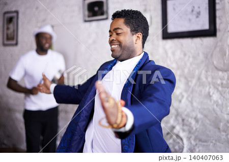 Happy, dance and black man at event with music, band and samba in celebration of culture in Brazil. Drums, musician and person moving with creative performance at party and joy from salsa or talent 140407063