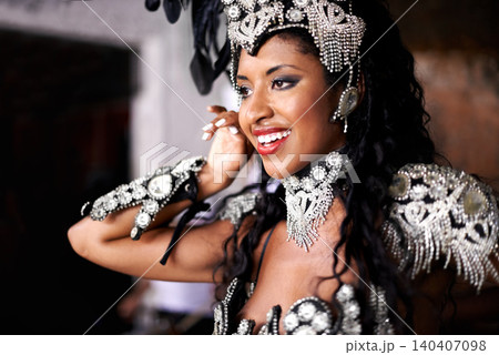 Dancer, carnival and woman with performance, happy and pride for culture on stage, music and band in night. Girl, smile and people dancing at event, party or celebration for history in Rio de Janeiro 140407098
