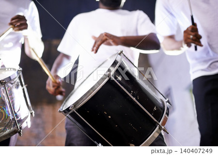Hands, drum or festival with a band playing an instrument in a carnival in Rio de Janeiro, Brazil. Night show, person or party with a musician, performer or artist banging to create a beat or rhythm 140407249