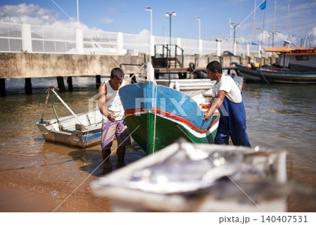 Lake, boat and fishermen by water for fishing industry in sea by outdoor dock for small business. Teamwork, labour and male people working with vessel at ocean harbor, marina or pier by shipyard. Lake, boat and fishermen by water for fishing industry in sea by outdoor dock for small business. Teamwork, labour and male people working with vessel at ocean harbor, marina or pier by shipyard. 140407531