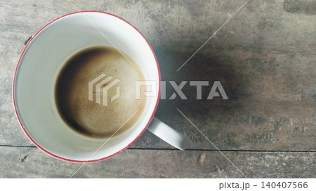 Empty Coffee Cup with Stains and Dregs on Wooden Table 140407566