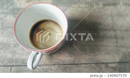 Empty Coffee Cup with Stains and Dregs on Wooden Table Empty Coffee Cup with Stains and Dregs on Wooden Table 140407570