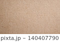 Close-up of natural brown kraft paper texture with subtle fiber details 140407790