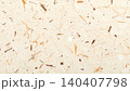 Close-up of handmade recycled paper texture with natural fiber inclusions 140407798