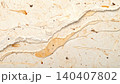 Close-up of handmade recycled paper texture with natural fiber inclusions 140407802