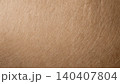 Close-up of natural brown kraft paper texture with subtle fiber details 140407804