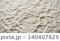 Extreme close-up of natural linen fabric texture with raw fiber detail 140407829