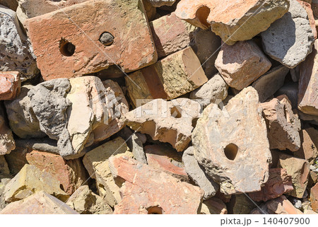 Construction debris from broken bricks close up 140407900