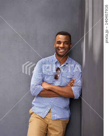 Man, smile and cool fashion in portrait by wall background, style and gen z outfit in outdoors. Happy black male person, university student and pride for aesthetic, confident and trendy clothes Man, smile and cool fashion in portrait by wall background, style and gen z outfit in outdoors. Happy black male person, university student and pride for aesthetic, confident and trendy clothes 140407916