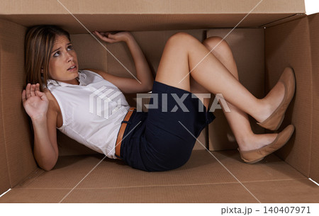 Business, box and fear with woman, scared and claustrophobic with emotion and reaction. Person, employee and entrepreneur with cardboard and anxiety with depression and afraid with fright and crisis Business, box and fear with woman, scared and claustrophobic with emotion and reaction. Person, employee and entrepreneur with cardboard and anxiety with depression and afraid with fright and crisis 140407971