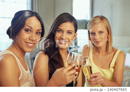Women, friends and portrait with champagne for celebration, party and luxury in hotel or bedroom. Face of a young group of people with wine glasses, cheers and toast for holiday or congratulations 140407983