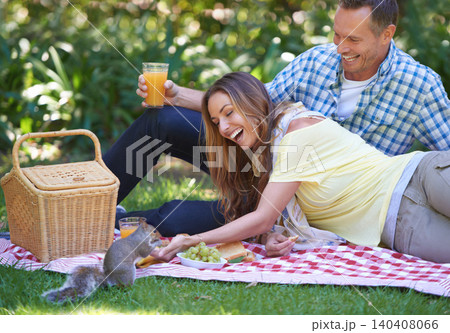 Romance, picnic and couple in park with squirrel, food and drinks on outdoor date together. Love, mature man and happy woman on garden lawn with morning sunshine, juice and marriage bonding in nature Romance, picnic and couple in park with squirrel, food and drinks on outdoor date together. Love, mature man and happy woman on garden lawn with morning sunshine, juice and marriage bonding in nature 140408066