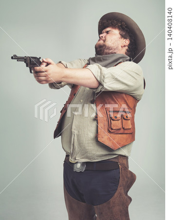 Cowboy, western man and shooting gun, weapon and pistol in studio with costume isolated on a white background. Plus size, criminal and male person with revolver, aim and scared with fear in Texas Cowboy, western man and shooting gun, weapon and pistol in studio with costume isolated on a white background. Plus size, criminal and male person with revolver, aim and scared with fear in Texas 140408140