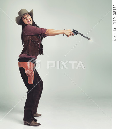 Cowgirl, woman and shooting gun, weapon or pistol in studio with costume isolated on white background mockup. Western, criminal and female person with revolver, scared or screaming in fear in Texas Cowgirl, woman and shooting gun, weapon or pistol in studio with costume isolated on white background mockup. Western, criminal and female person with revolver, scared or screaming in fear in Texas 140408173