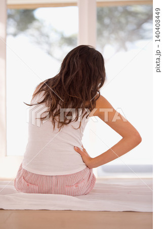 Woman, backache and pain on bed, fibromyalgia and injury in home for discomfort in menstrual issues. Female person, back and inflammation on joints in bedroom, muscle strain and hurt by bad posture Woman, backache and pain on bed, fibromyalgia and injury in home for discomfort in menstrual issues. Female person, back and inflammation on joints in bedroom, muscle strain and hurt by bad posture 140408449