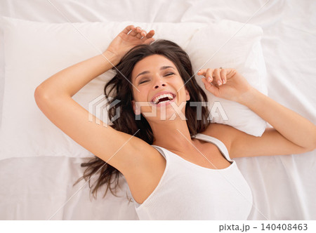 Laughing, relax or above of woman in bed for resting in pyjamas to wake up alone in home. Morning, calm or top view of excited female person on break or pillow with smile, ready to start day or chill Laughing, relax or above of woman in bed for resting in pyjamas to wake up alone in home. Morning, calm or top view of excited female person on break or pillow with smile, ready to start day or chill 140408463