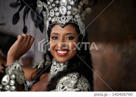 Portrait, woman or dancer to smile for carnival, costume and jewelry with sparkle, bling or diamante. Black female person, red lipstick and dancing with energy, action and movement in Rio de Janeiro Portrait, woman or dancer to smile for carnival, costume and jewelry with sparkle, bling or diamante. Black female person, red lipstick and dancing with energy, action and movement in Rio de Janeiro 140408700