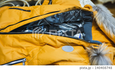 Yellow winter jacket with fur hood and thermal lining, ready for cold weather 140408748