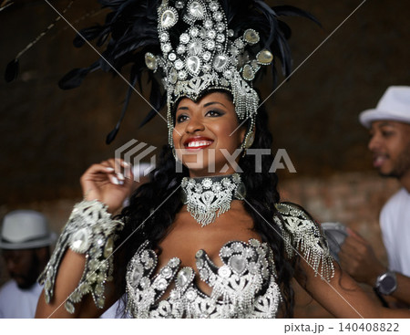 Dancer, happy and samba performance at night for celebration in Rio de janeiro for carnival season. Female person, costume and feathers for culture and show, creativity and confidence at festival Dancer, happy and samba performance at night for celebration in Rio de janeiro for carnival season. Female person, costume and feathers for culture and show, creativity and confidence at festival 140408822