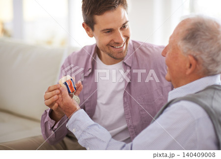 Senior, man and son or medal on sofa with war badge, pride and honor for military hero in living room of home. Elderly, veteran and retired soldier with medallion for service in army with happiness Senior, man and son or medal on sofa with war badge, pride and honor for military hero in living room of home. Elderly, veteran and retired soldier with medallion for service in army with happiness 140409008