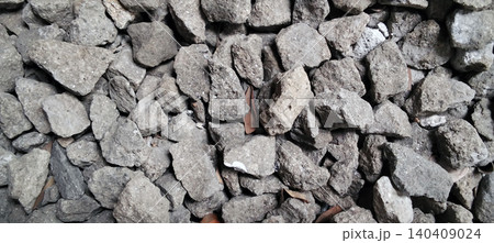 A pile of gray gravel and crushed stone commonly used as building materials. 140409024