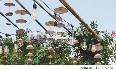 Vietnamese traditional conical hats hanging with light bulbs during Vietnam Days in Moscow 140409218
