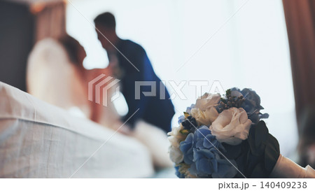 Bridal bouquet with blue and white flowers in focus, out of focus in a bright room. Bridal bouquet with blue and white flowers in focus, out of focus in a bright room. 140409238