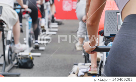 Athletes pedaling on exercise bikes during sports day 140409293