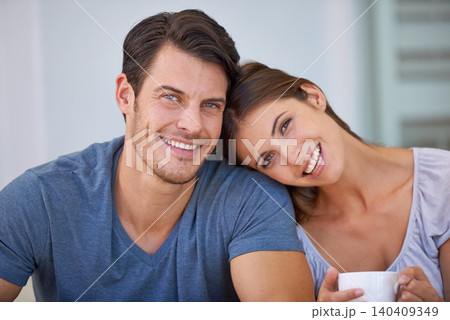Happy couple, portrait and coffee with love for morning, bonding or weekend together at home. Face of young man and woman with smile, cup of tea or cappuccino for support, care or trust at apartment Happy couple, portrait and coffee with love for morning, bonding or weekend together at home. Face of young man and woman with smile, cup of tea or cappuccino for support, care or trust at apartment 140409349