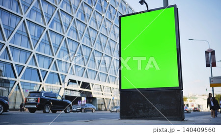 Blank green screen billboard mockup on a busy city street with modern architecture Blank green screen billboard mockup on a busy city street with modern architecture 140409560