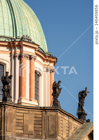 Historic church dome with statues and blue sky 140409956