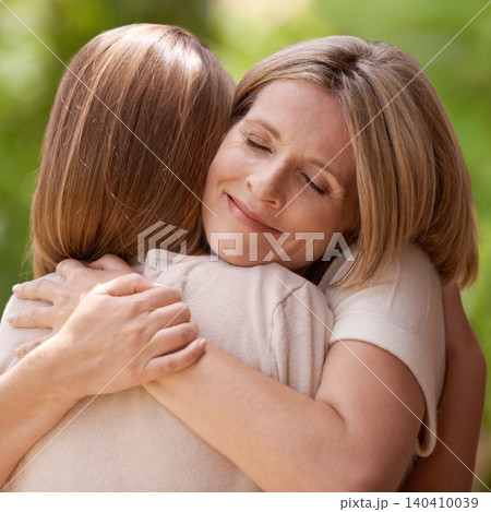 Parent, daughter and hug with support outdoors in nature for mothers day, care and affection for gratitude. Mom, girl child and bonding together on summer vacation for love, smile and closeup Parent, daughter and hug with support outdoors in nature for mothers day, care and affection for gratitude. Mom, girl child and bonding together on summer vacation for love, smile and closeup 140410039