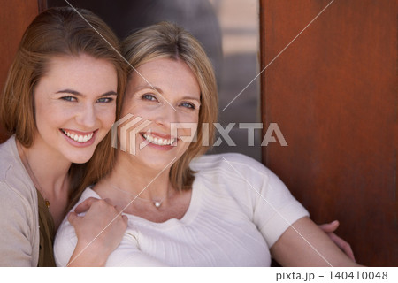 Mother, daughter and hug with smile, bonding and love for happiness at home. Women, motherhood and house for growth, connection and positivity while relaxing with embrace and sunshine, joy or fun 140410048
