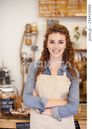 Portrait, welcome and happy woman with confidence in cafe service with small business owner. Coffee shop, restaurant or waitress with smile, hospitality or entrepreneur with arms crossed at startup. Portrait, welcome and happy woman with confidence in cafe service with small business owner. Coffee shop, restaurant or waitress with smile, hospitality or entrepreneur with arms crossed at startup. 140410066
