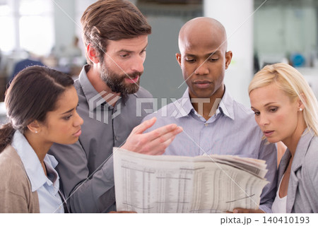 Business people, newspaper and reading in team for information, stock market or search at office. Group of employees with document or paper for finance, planning or investment review at workplace Business people, newspaper and reading in team for information, stock market or search at office. Group of employees with document or paper for finance, planning or investment review at workplace 140410193