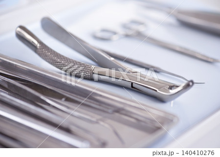 Dental, instrument and tools equipment as closeup for treatment consultation for examination, cleaning or hygiene. Explorers, scaler and teeth care for oral help for dentist checkup, tooth or forceps Dental, instrument and tools equipment as closeup for treatment consultation for examination, cleaning or hygiene. Explorers, scaler and teeth care for oral help for dentist checkup, tooth or forceps 140410276