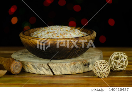 Porridge with walnuts raisin poppy. Plate with kutia with dried fruits. Christmas porridge on wooden background. Wheat porridge which on Eve Christmas. Porridge with walnuts raisin poppy. Plate with kutia with dried fruits. Christmas porridge on wooden background. Wheat porridge which on Eve Christmas. 140410427