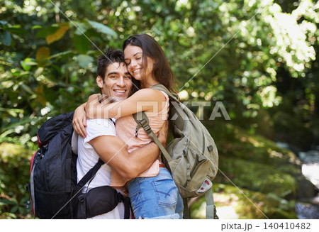 Hiking, forest or portrait of happy couple hug in nature or wilderness on a trekking adventure. Man, woman or romantic people in natural park or woods with care love or wellness on holiday vacation Hiking, forest or portrait of happy couple hug in nature or wilderness on a trekking adventure. Man, woman or romantic people in natural park or woods with care love or wellness on holiday vacation 140410482