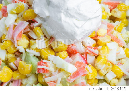 Corn, crab stick, and egg salad with sour cream. Close-up of crab salad. 140410545
