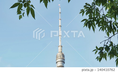 Ostankino Tower, Moscow, providing broadcasting and telecommunications through green foliage Ostankino Tower, Moscow, providing broadcasting and telecommunications through green foliage 140410762