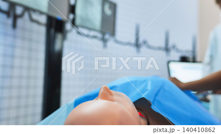 Medical simulation mannequin laying on bed for healthcare training in hospital Medical simulation mannequin laying on bed for healthcare training in hospital 140410862