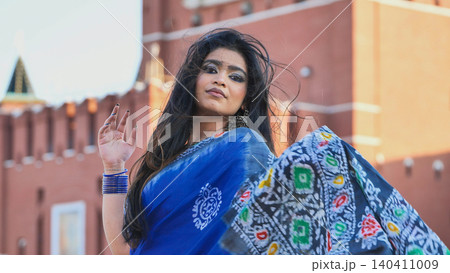 Bangladeshi woman wearing saree in Moscow, showcasing cultural diversity and travel 140411009