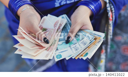 Woman's hands holding Russian rubles, concept of finance, economy, and prosperity 140411022