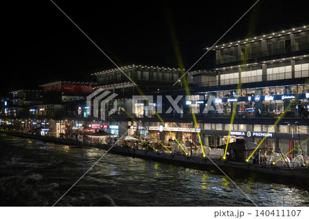 Tashkent, Uzbekistan - February 02, 2026: Seoul Mun Street. Blue and green Light Show at Seoul Mun Riverside District in Tashkent at Night. Tashkent, Uzbekistan - February 02, 2026: Seoul Mun Street. Blue and green Light Show at Seoul Mun Riverside District in Tashkent at Night. 140411107