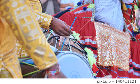 Indian dhol drummer playing during a cultural festival event in Moscow Indian dhol drummer playing during a cultural festival event in Moscow 140411121