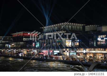 Tashkent, Uzbekistan - February 02, 2026: Seoul Mun Street. Blue and green Light Show at Seoul Mun Riverside District in Tashkent at Night. Tashkent, Uzbekistan - February 02, 2026: Seoul Mun Street. Blue and green Light Show at Seoul Mun Riverside District in Tashkent at Night. 140411131