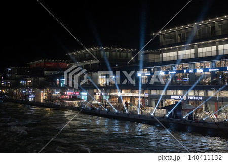 Tashkent, Uzbekistan - February 02, 2026: Seoul Mun Street. Blue and green Light Show at Seoul Mun Riverside District in Tashkent at Night. Tashkent, Uzbekistan - February 02, 2026: Seoul Mun Street. Blue and green Light Show at Seoul Mun Riverside District in Tashkent at Night. 140411132