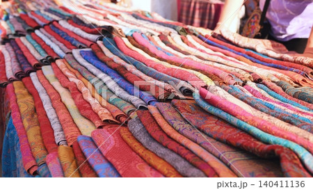 Vibrant Indian textile patterns creating a colorful display at a Moscow market 140411136