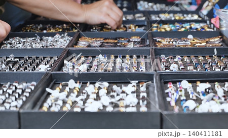 Customer browsing handmade jewelry at an India Day festival market in Moscow Customer browsing handmade jewelry at an India Day festival market in Moscow 140411181